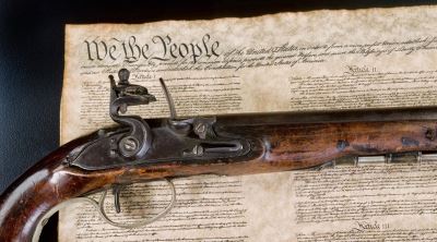 Gun on top of the Constitution